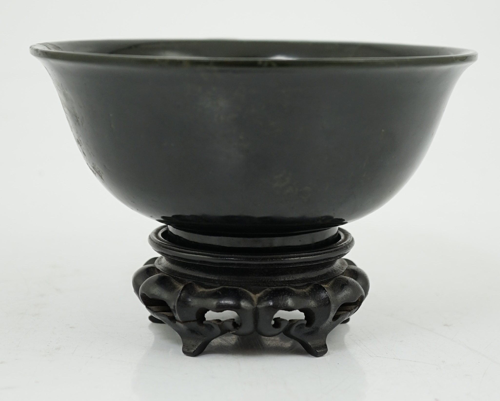 A Chinese dark spinach green jade bowl, engraved Qianlong seal mark but 19th/20th century